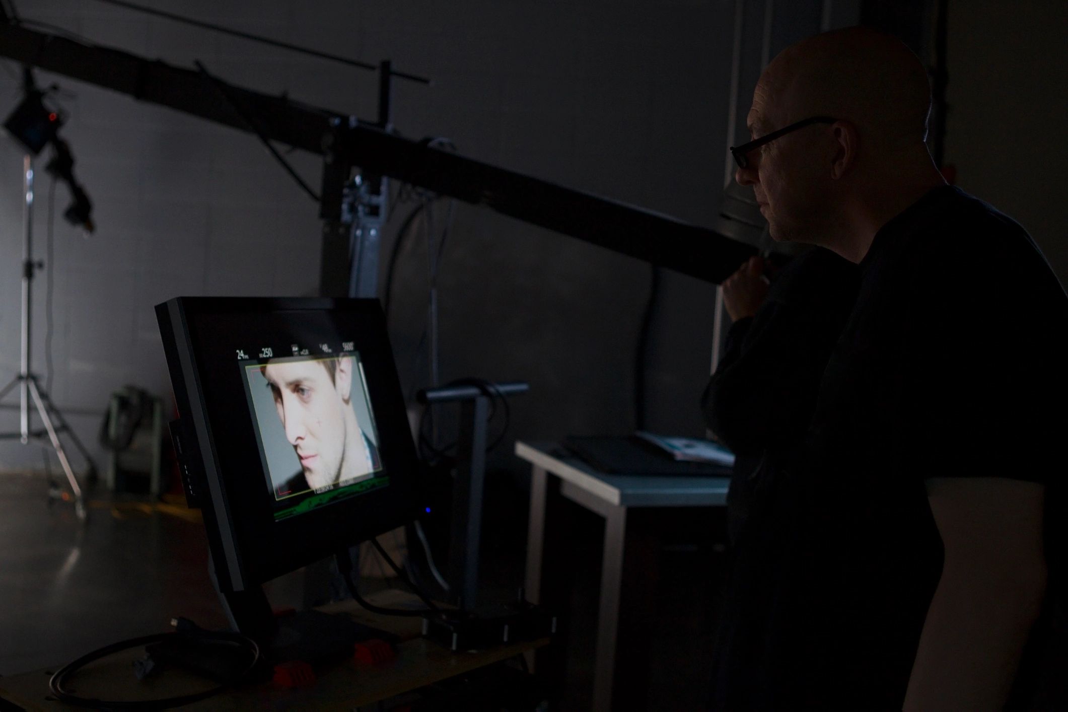 People working behind the scenes while filming on a film set