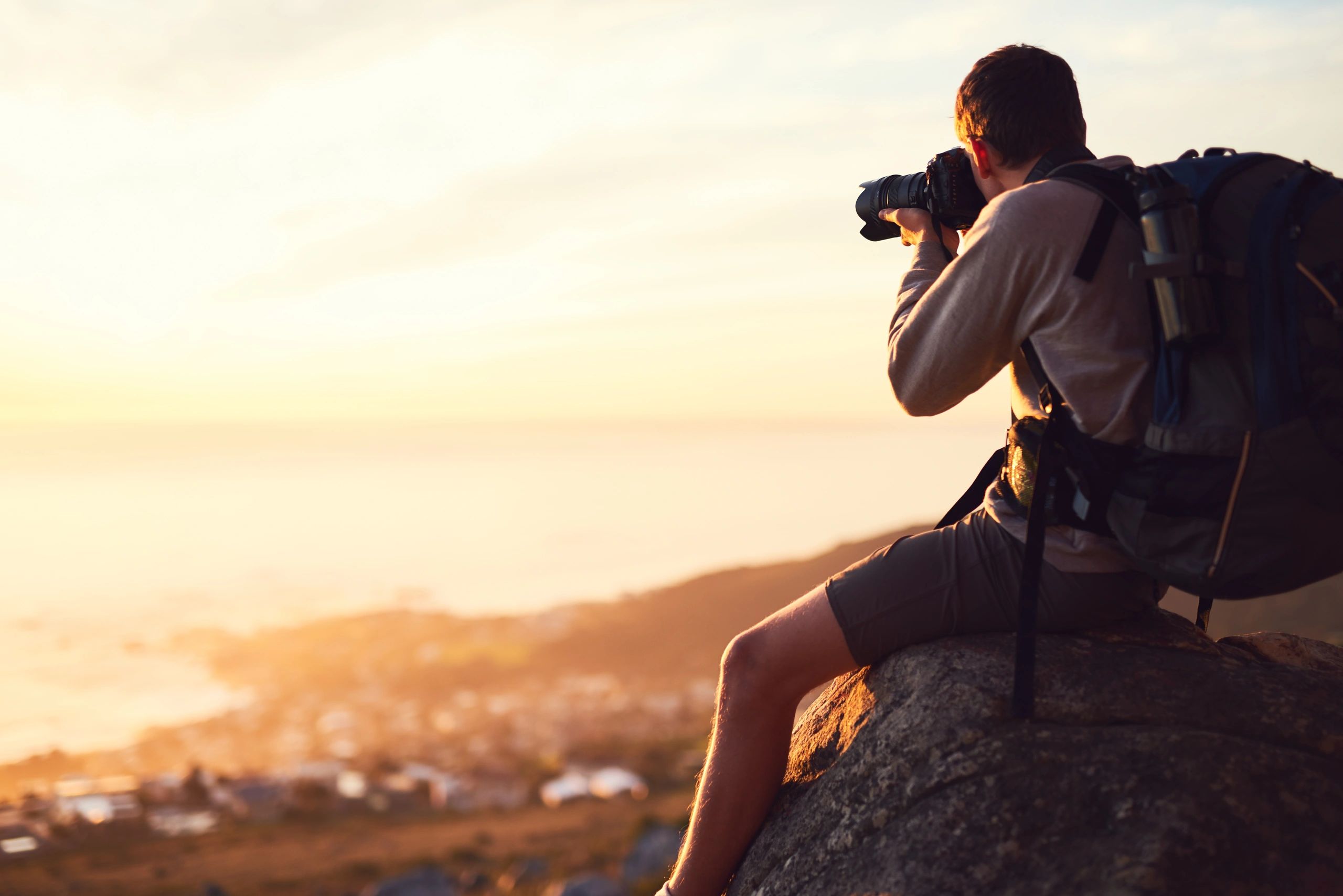 Photographer capturing an image outdoors